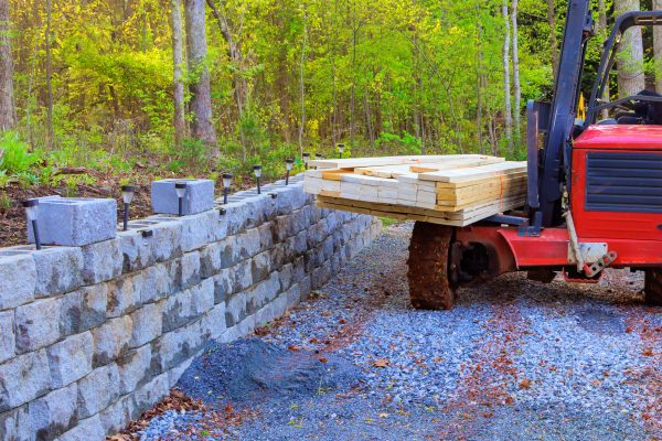Building materials are being delivered by contractor using forklift